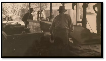 Above and below — Grandpa Tobin working in the sawmill.